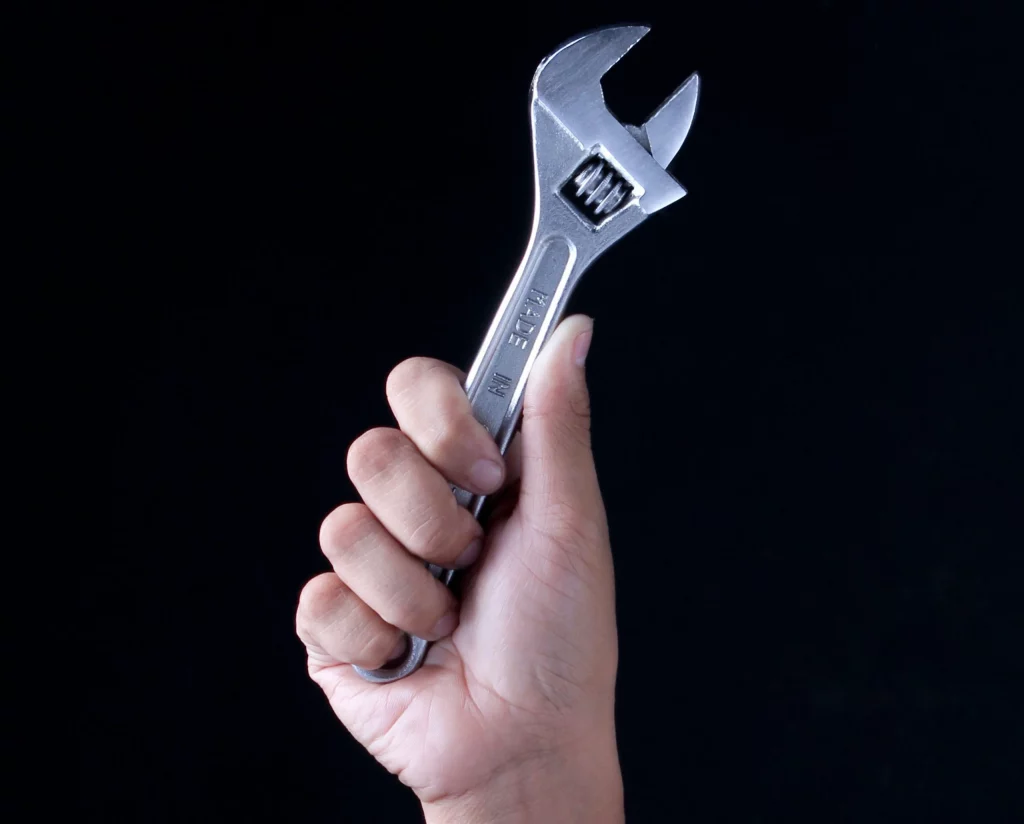 A plumber holding a wrench